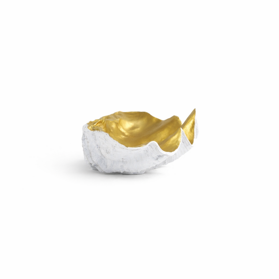 40cm wide clam-shaped decorative bowl with textured white exterior and polished gold interior on a modern coffee table.