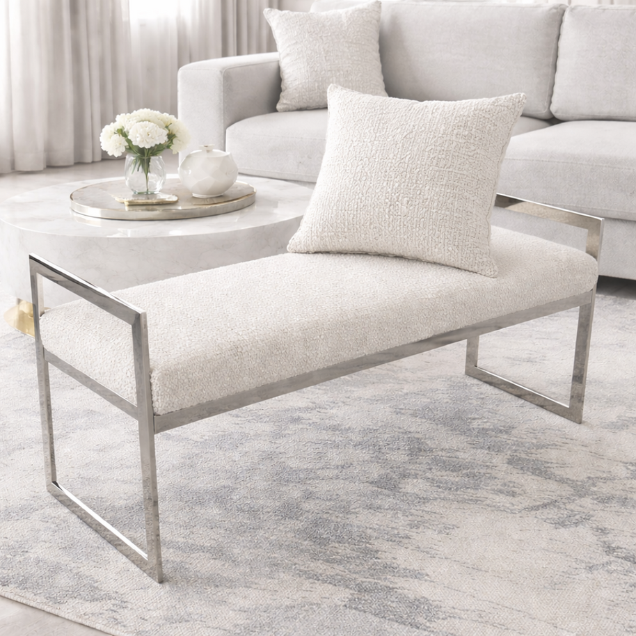 Modern living room with a white bench, sofa, and coffee table.