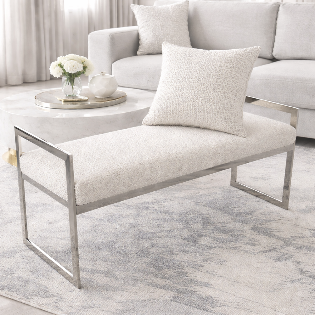 Modern living room with a white bench, sofa, and coffee table.