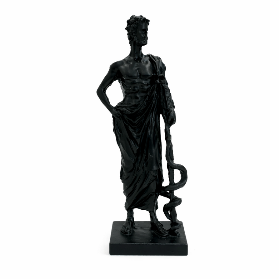 Minimalist black statue of a standing figure with a staff and draped robe on a white background.
