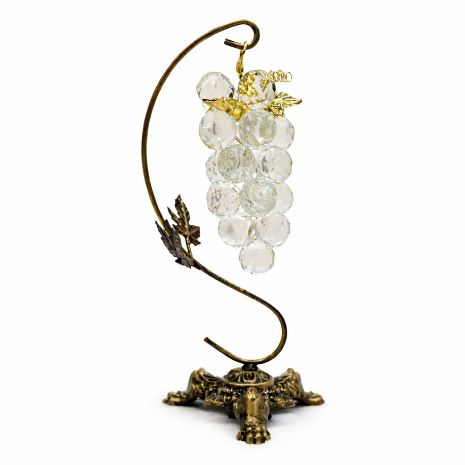 Crystal Vine ornament with clear faceted glass beads and aged brass leaves on a classic fireplace mantle.