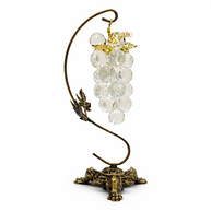 Crystal Vine ornament with clear faceted glass beads and aged brass leaves on a classic fireplace mantle.