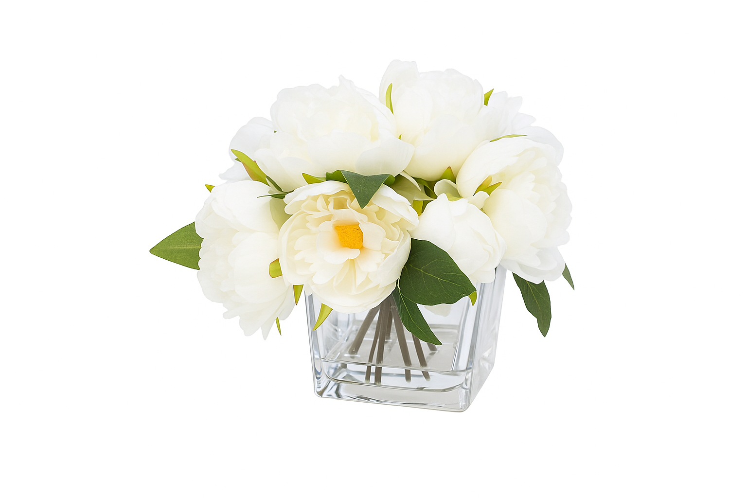 White flowers in a clear glass vase on a white background