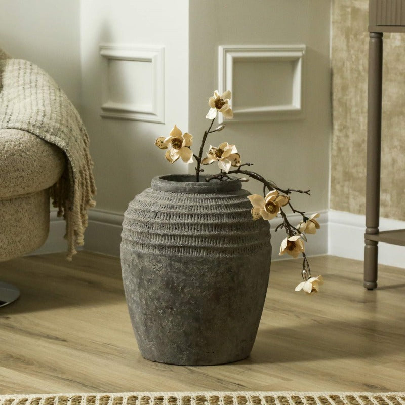 Handmade_Antique_Dark_Grey_Terracotta_Pot On Floor with flower inside