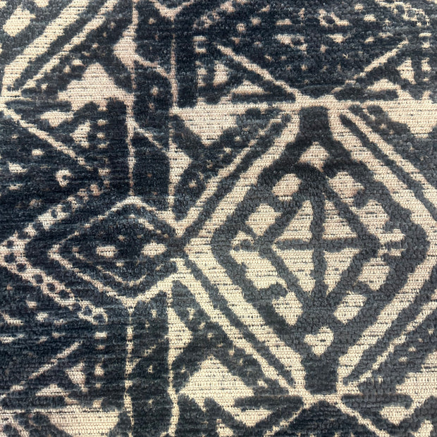 Close-up of a textured fabric with geometric pattern in navy blue and white