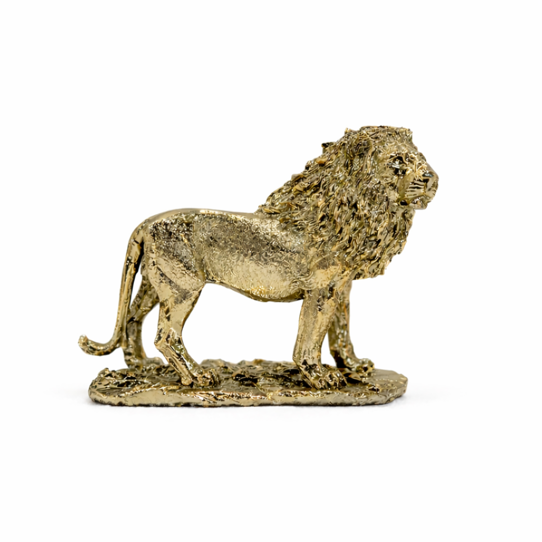 Gold-finish lion sculpture with a textured mane and a strong stance on a black minimalist shelf.