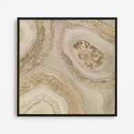 Framed artwork with a beige and brown abstract design on a white background
