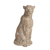 35cm stone-effect leopard sculpture with a realistic textured finish, styled in a modern garden among green shrubbery.