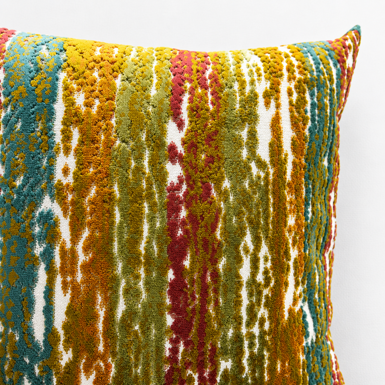 Multicolored textured pillow on a white background