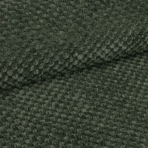 Close-up of dark green textured fabric