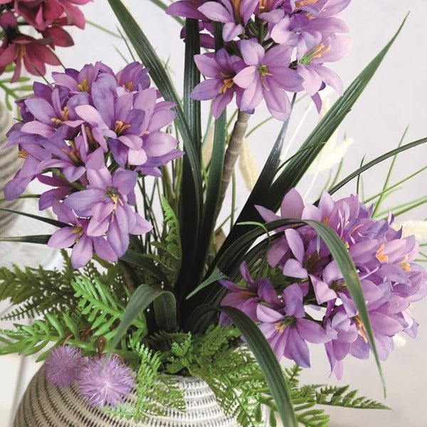 Purple Flower Arrangement in Textured Pot