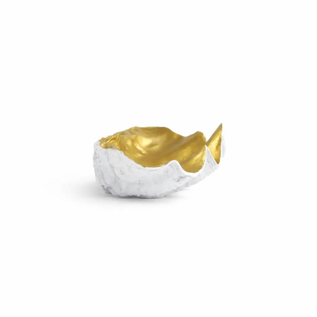 40cm wide clam-shaped decorative bowl with textured white exterior and polished gold interior on a modern coffee table.