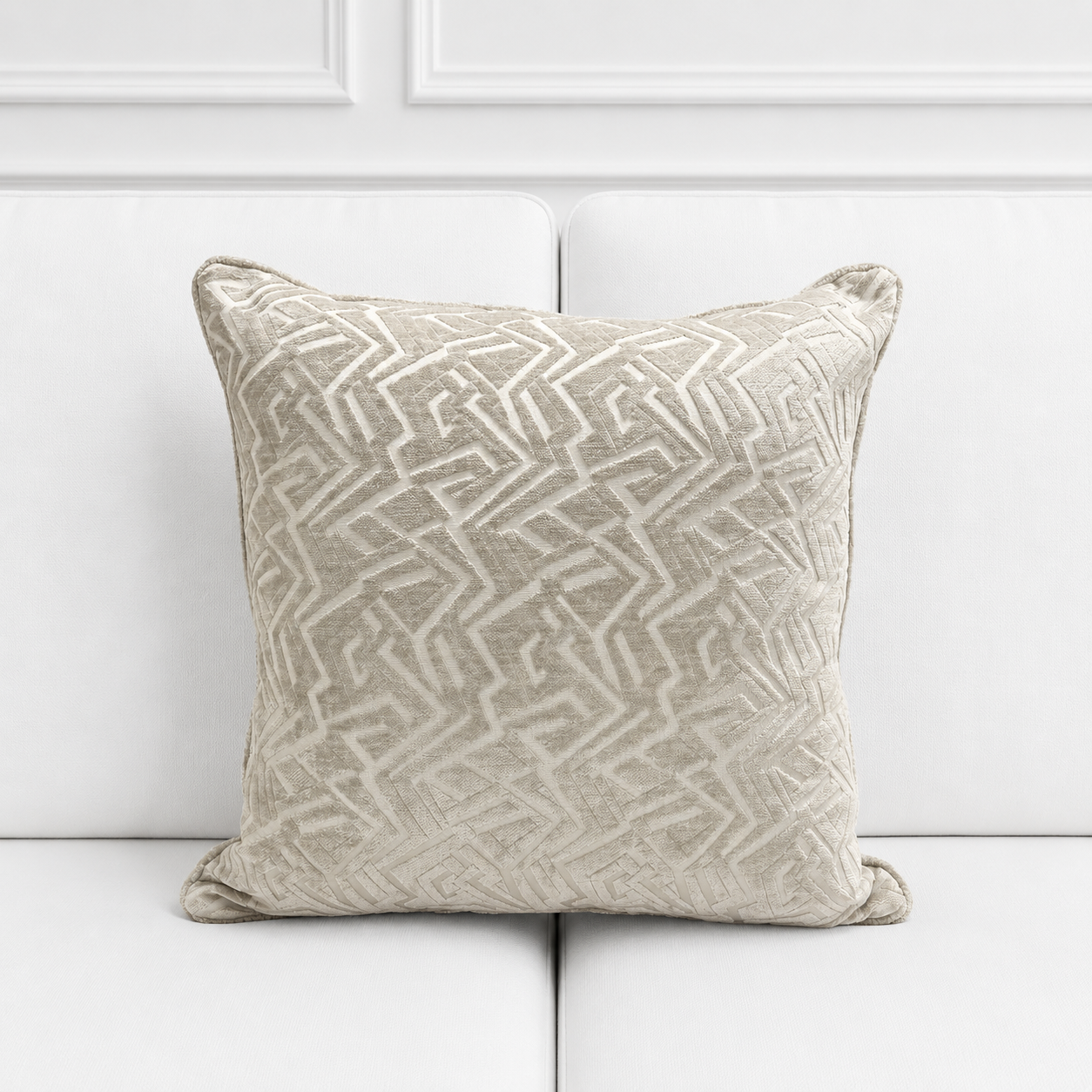 Decorative pillow with geometric pattern on a white background