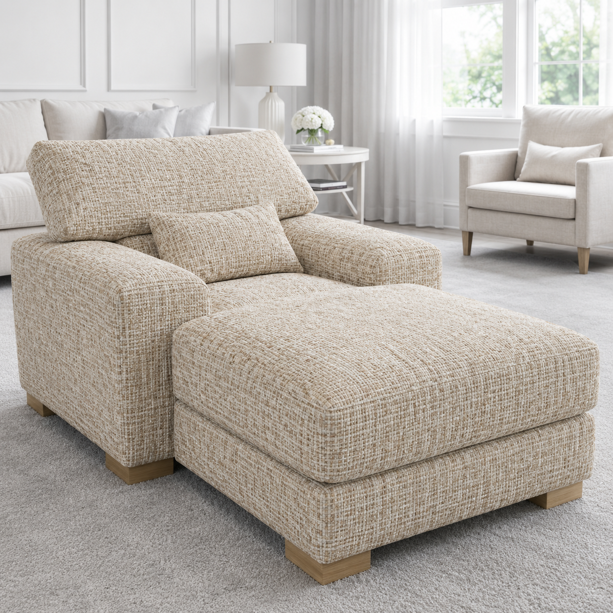 Beige sectional sofa in a living room setting with neutral decor.