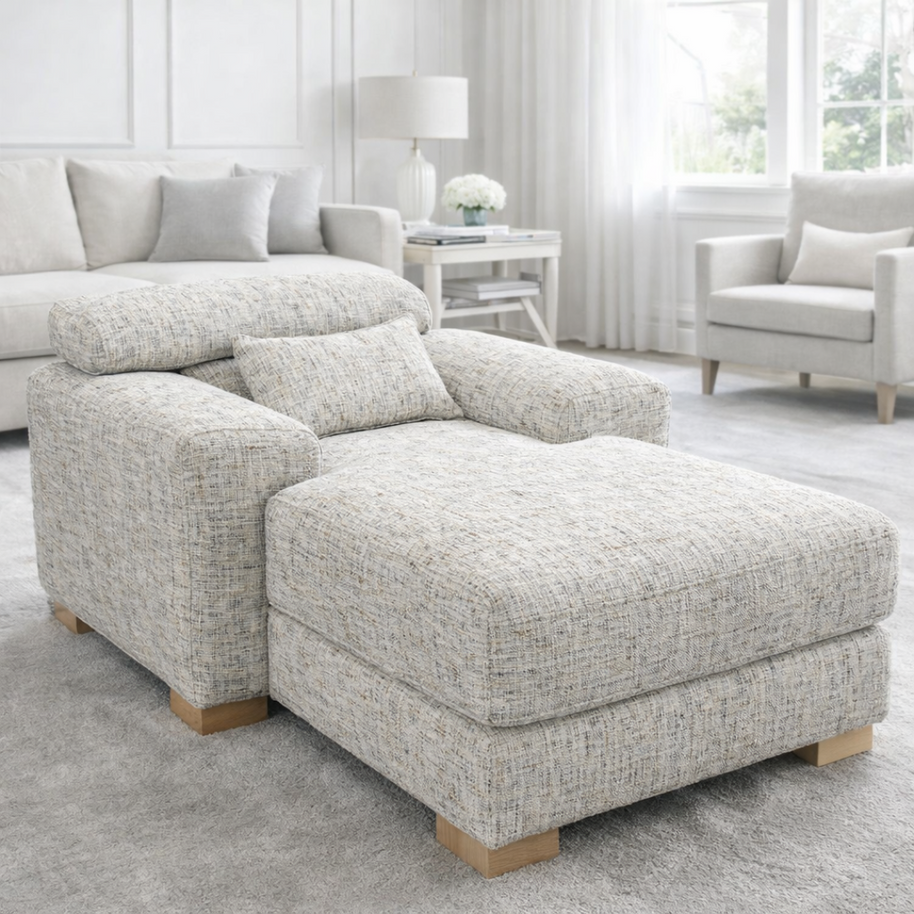 Gray textured sectional sofa in a living room setting with neutral decor.